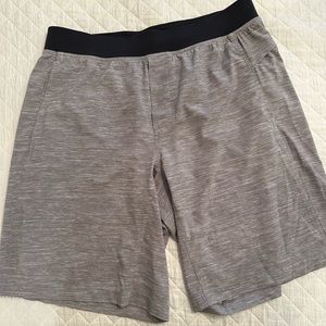 Lululemon Men’s shorts, 9”, Size 34, gray with black waist band, pull on style